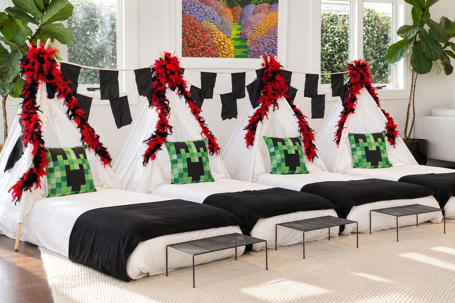 Gamer Zone teepee sleepover with red and black feather teepee decorations and black bunting