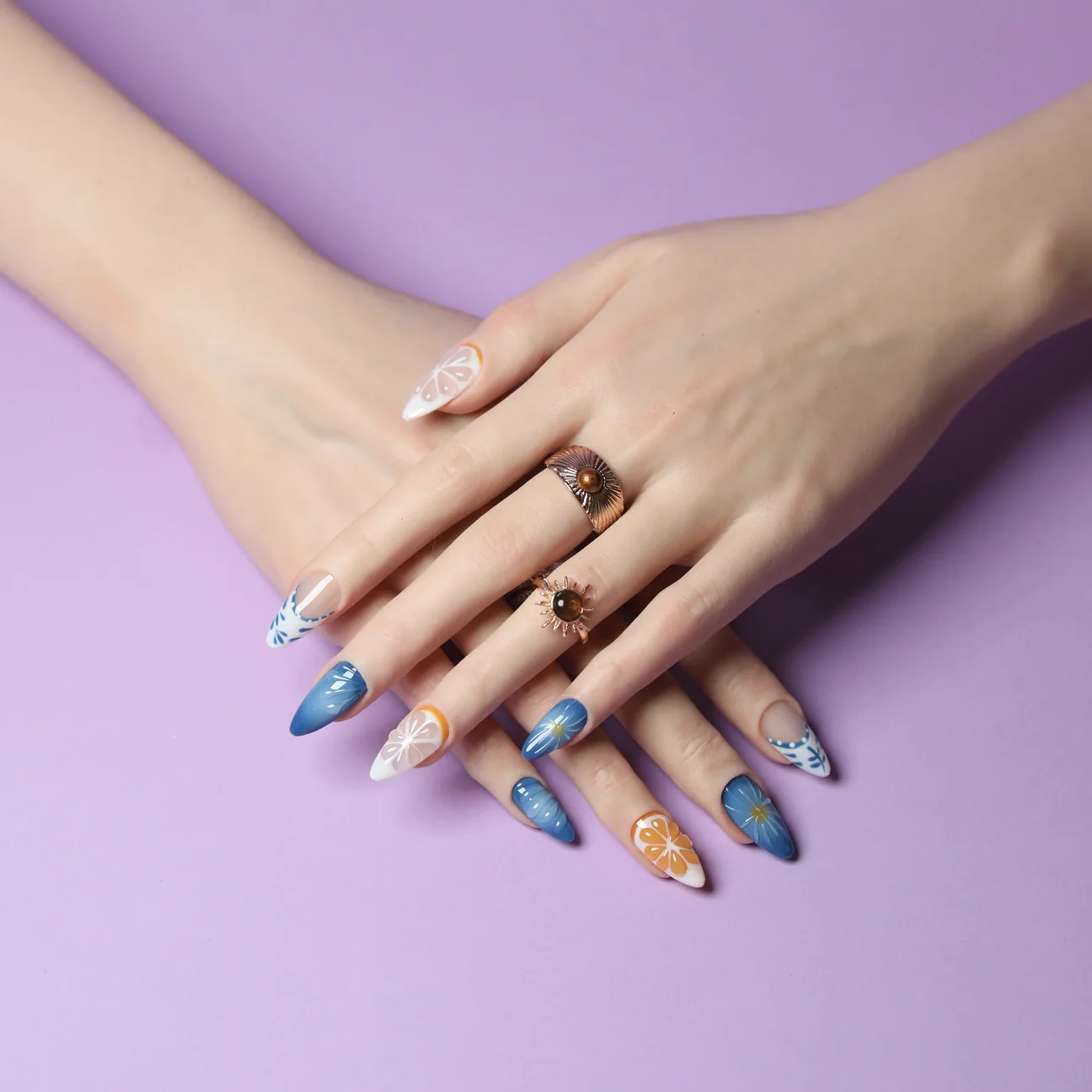 Citrus press-on nails in blue and orange