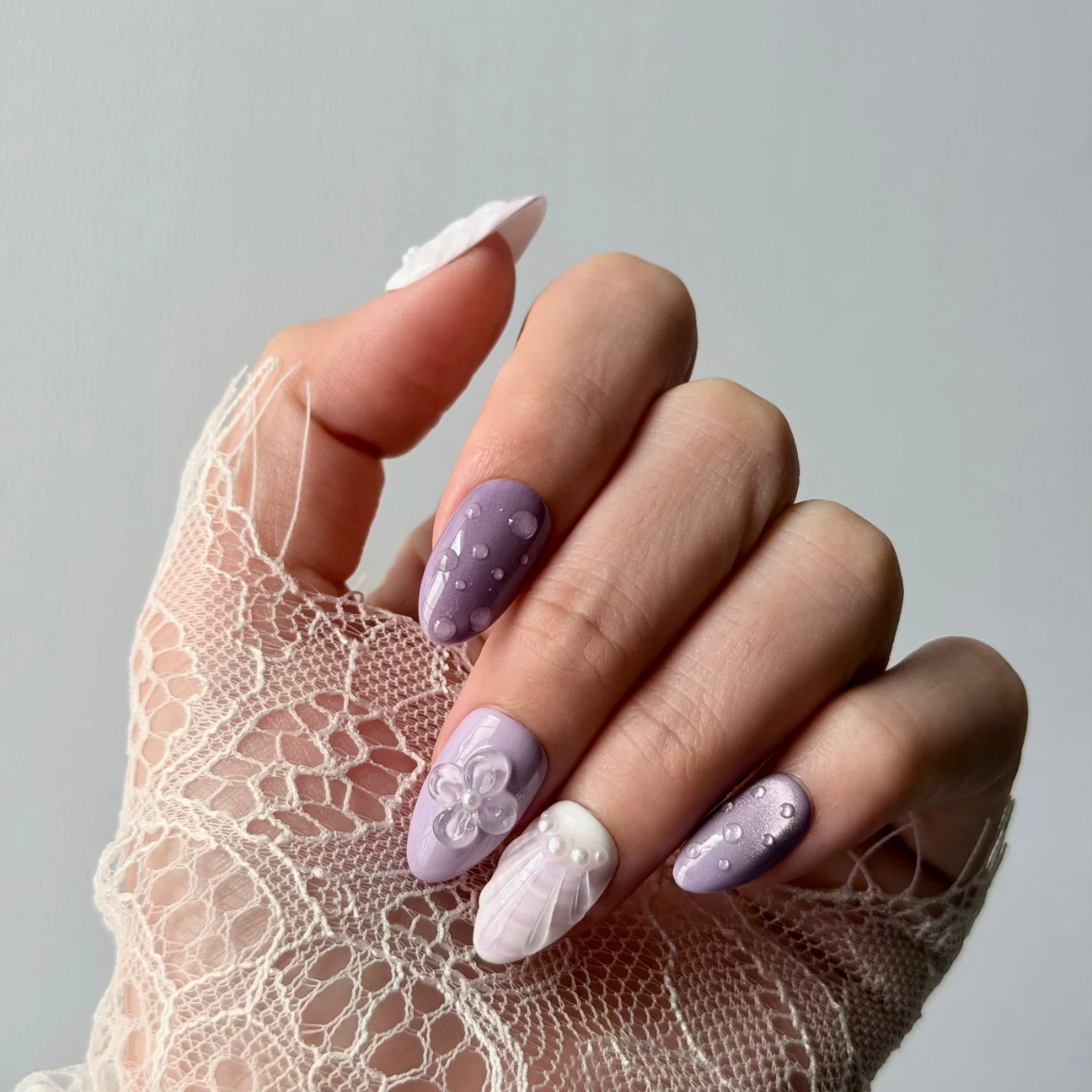 Lavender Beachy press-on nails worn on a hand